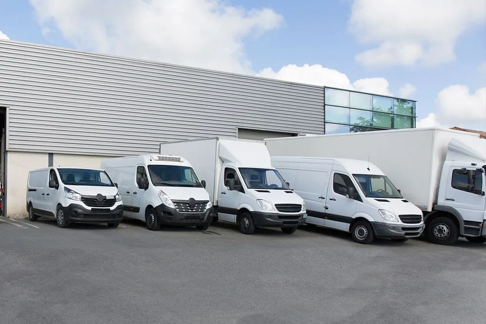 Logistics trucks staged at distribution center supported by Kann Enterprises workforce solutions