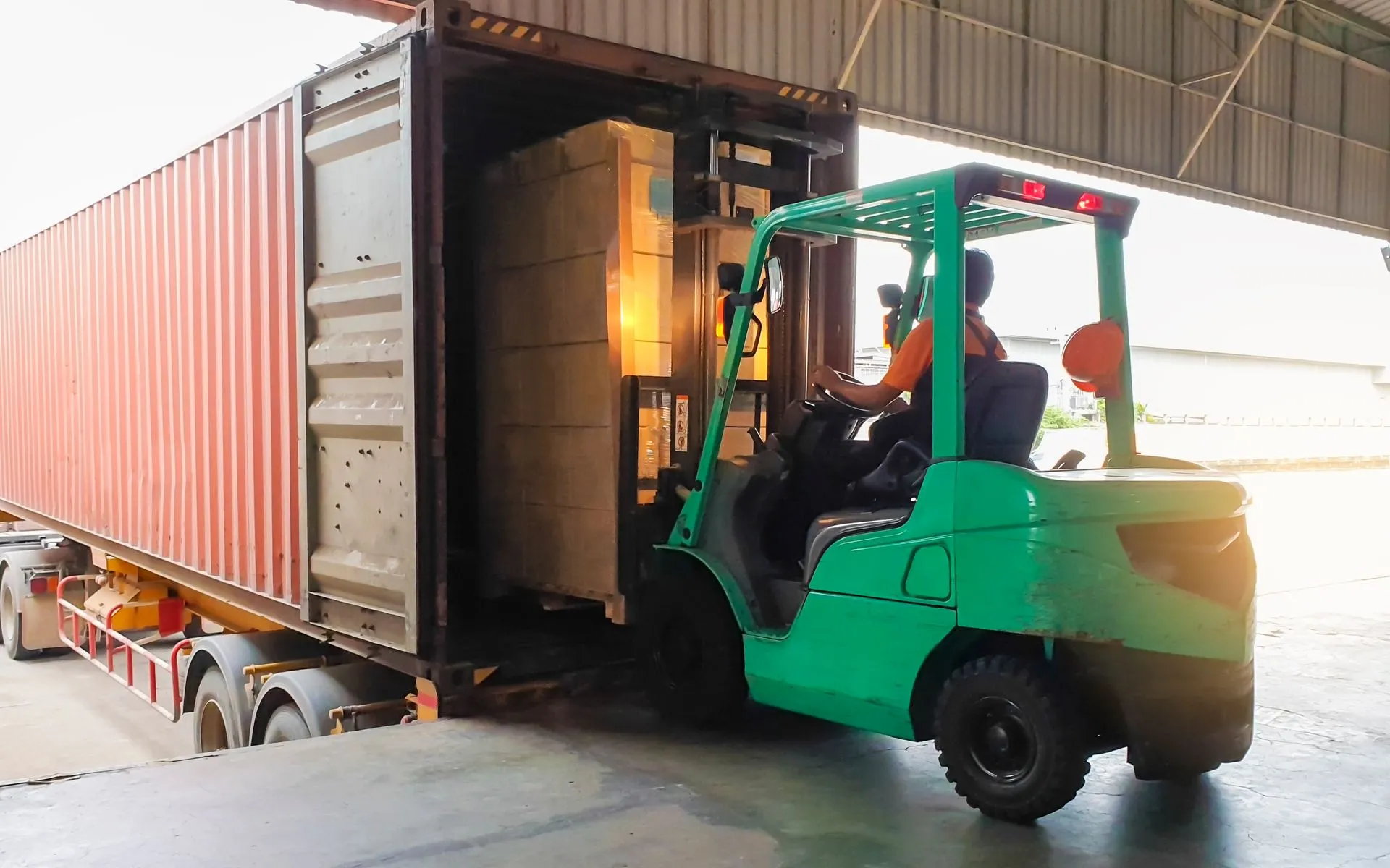 Material handlers performing loading and unloading services by Kann Enterprises logistics partner